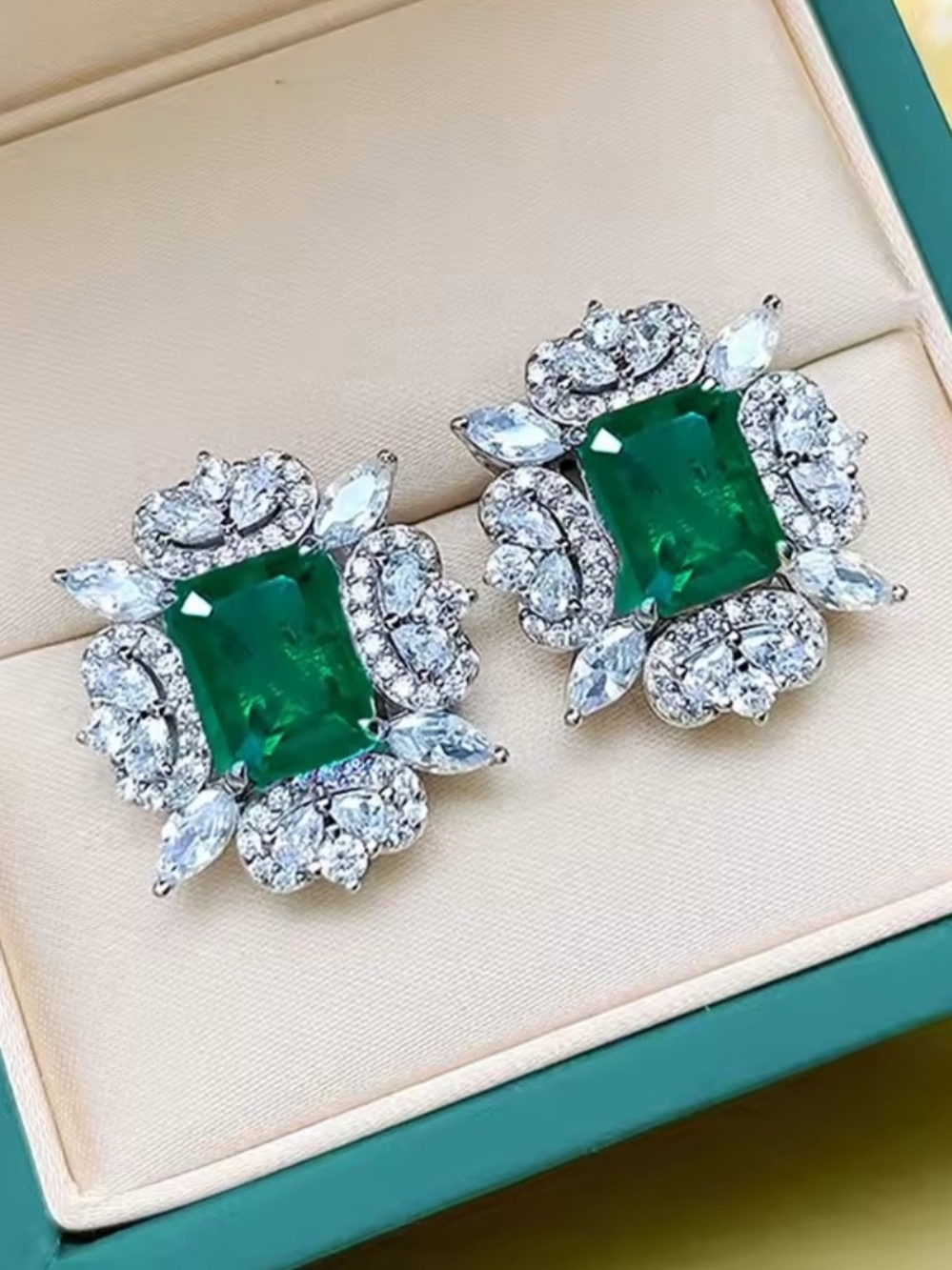 White Rhodium Emerald Halo Stud Earrings